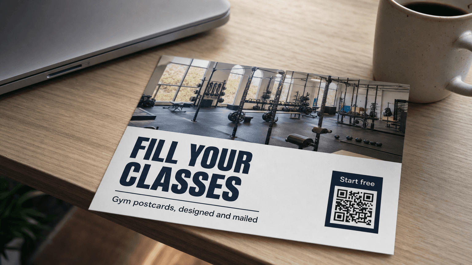 A fitness postcard reading 'Fill Your Classes' with a photo of a modern gym, on a desk.