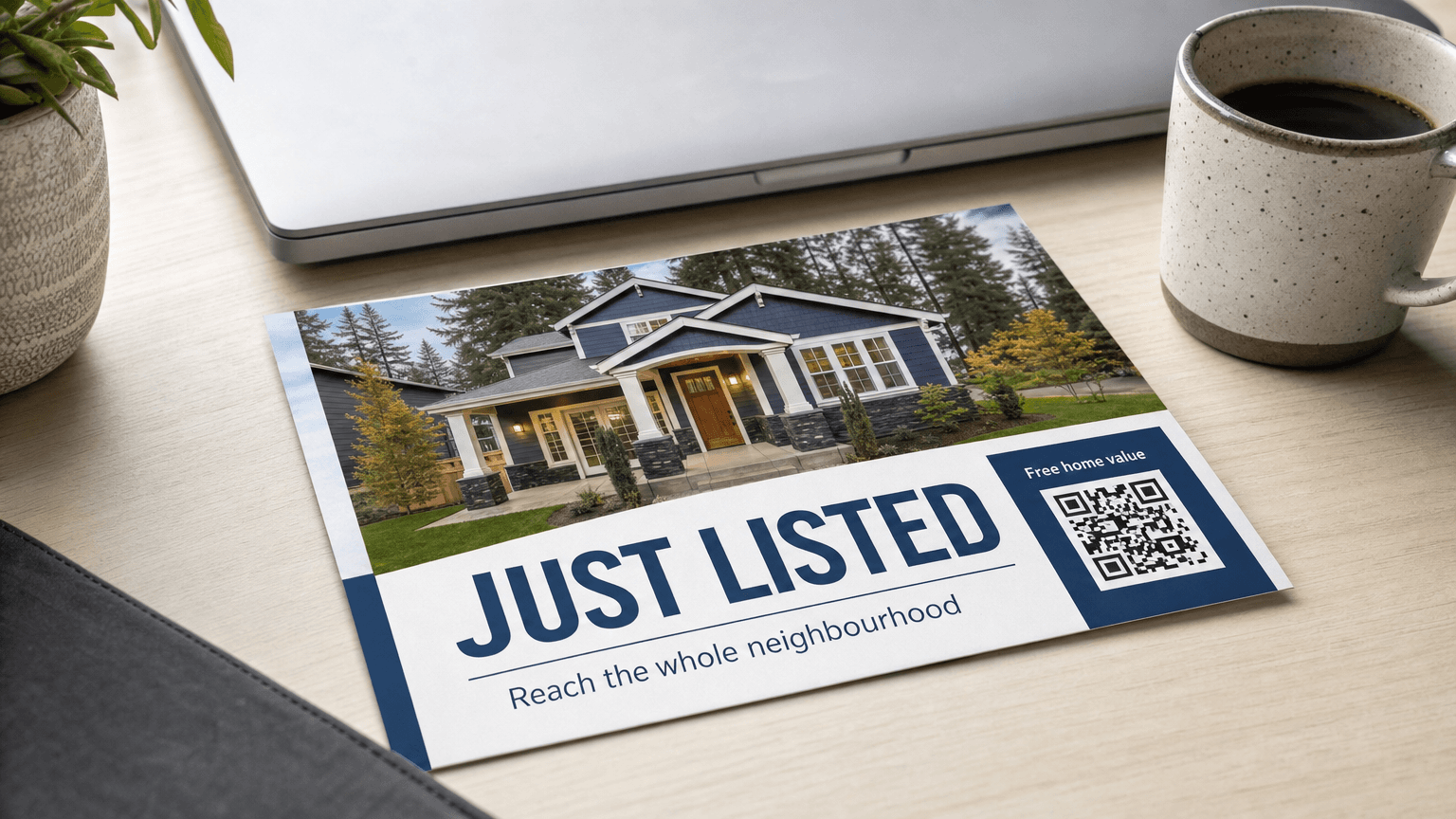 A 'Just Listed' real estate postcard with a house photo, on a desk.