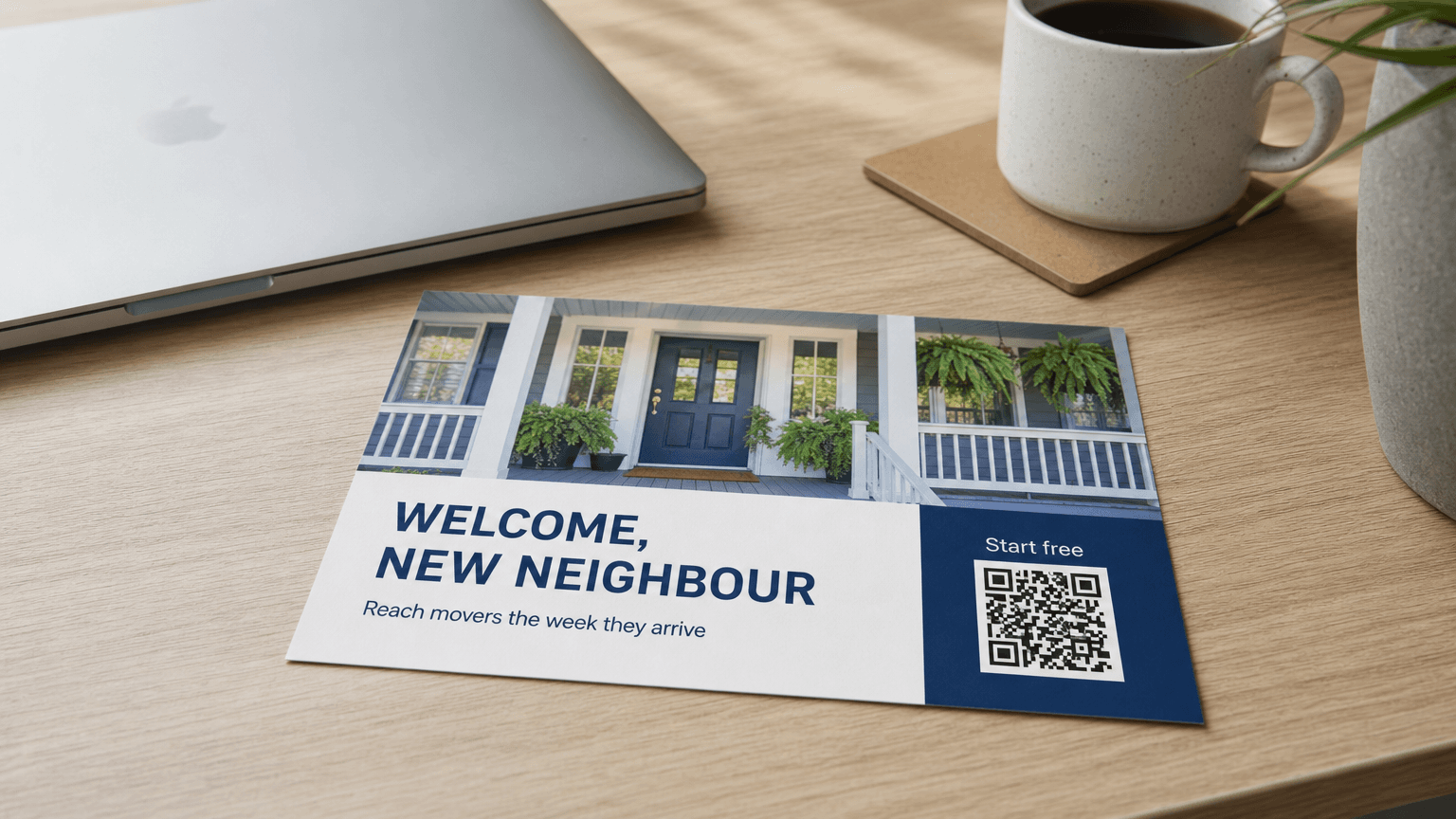 A new-mover postcard reading 'Welcome, New Neighbour' with a home photo, on a desk.