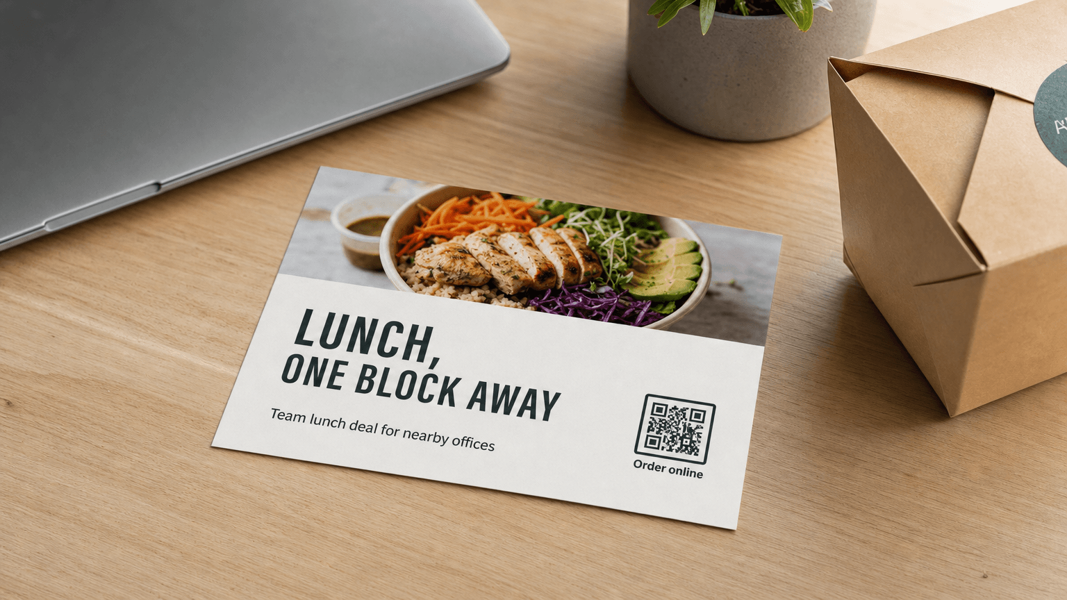 A restaurant lunch postcard reading 'Lunch, One Block Away' on an office desk.