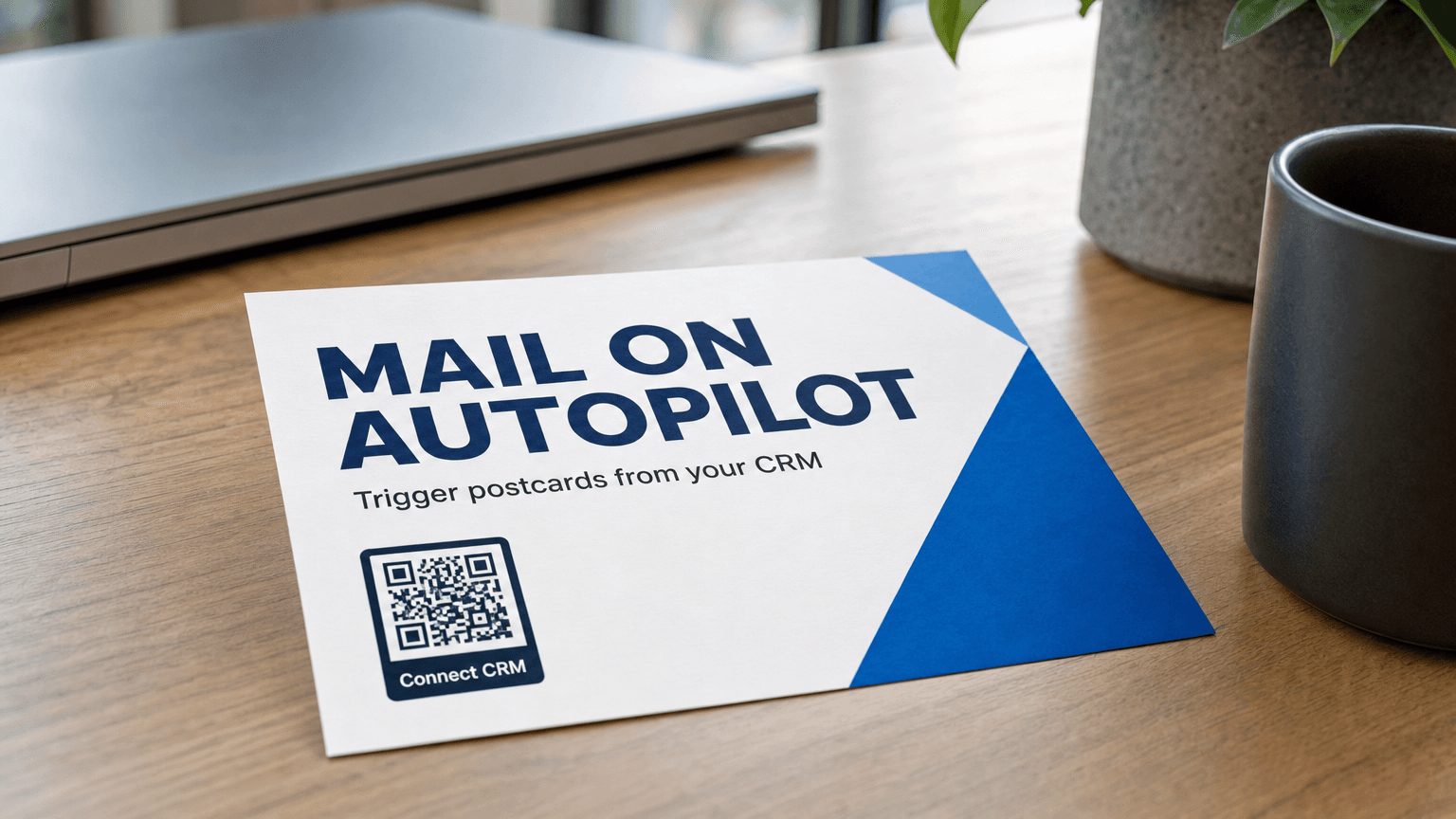 A CRM direct mail postcard reading 'Mail on Autopilot' on a desk.